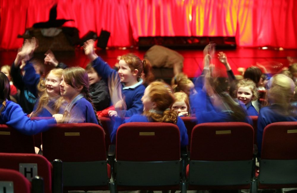 School children attending a performance at An Grianán Theatre. Photo by Declan Doherty.