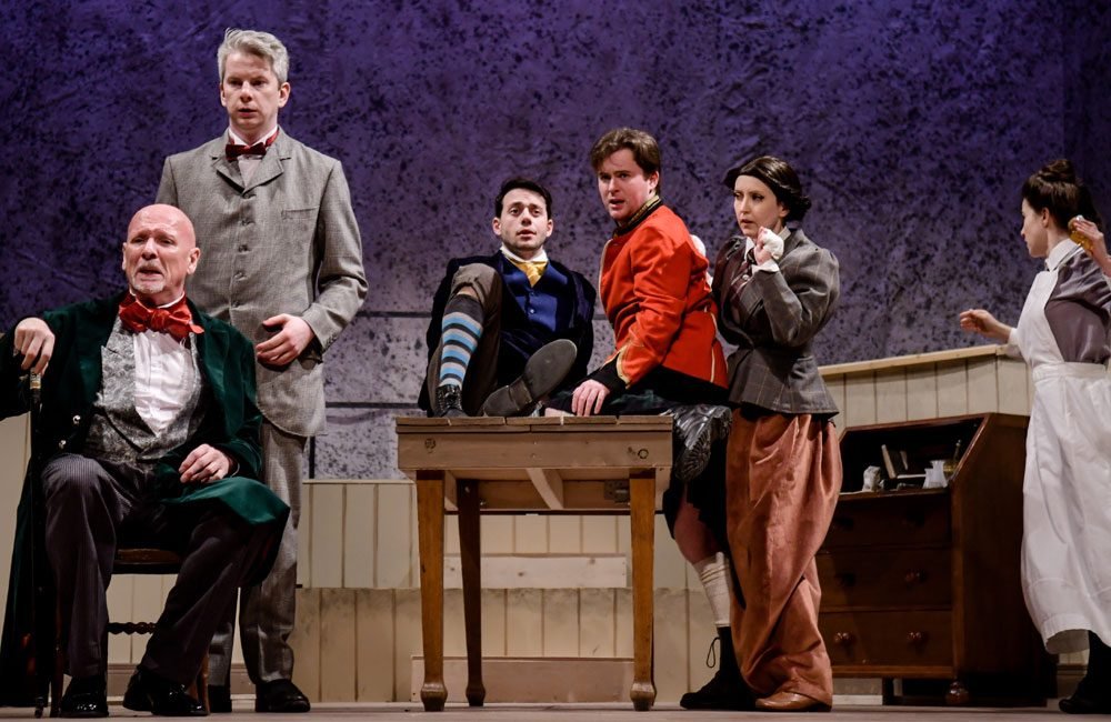 A production photo showing the cast of The Barber of Seville by the Ulster Touring Opera Co.