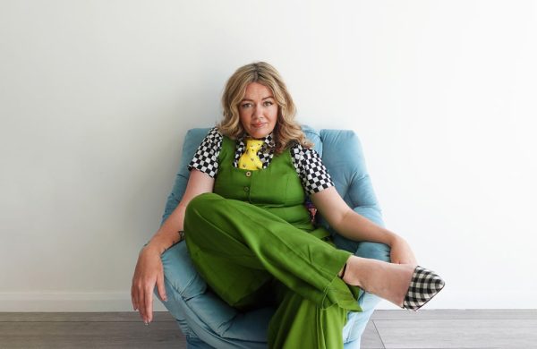 Image is of comedian Serena Terry sitting on an armchair.